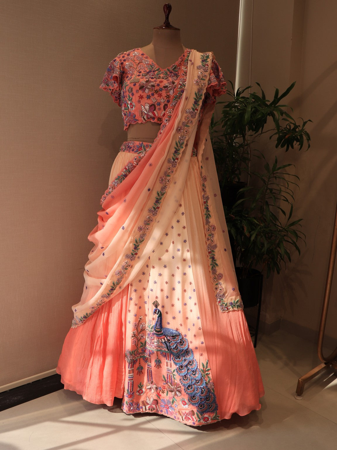 Peach shaded shrinathji peacock embroidered lehenga set