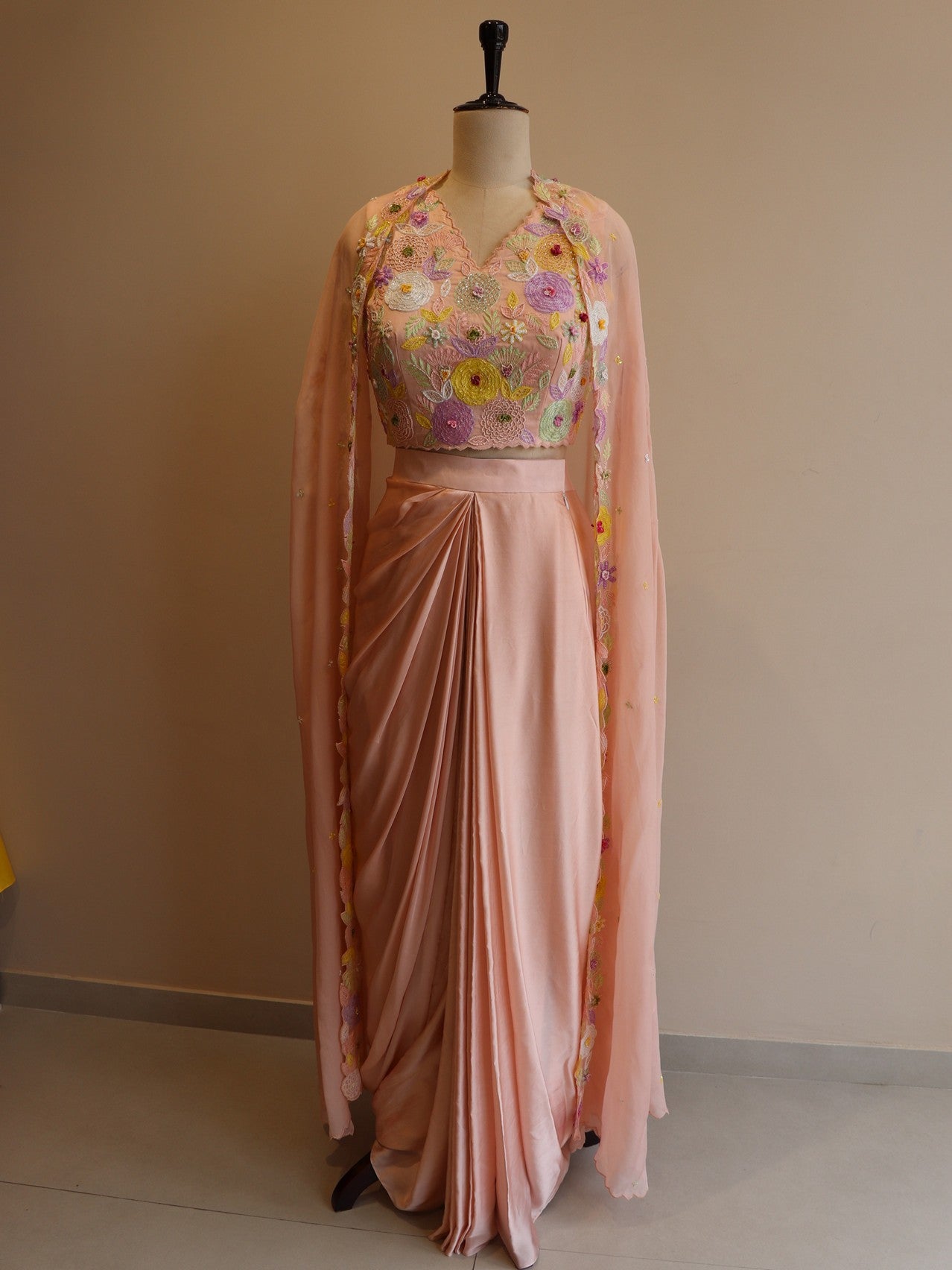 Pastel peach crop top with drape skirt and cape