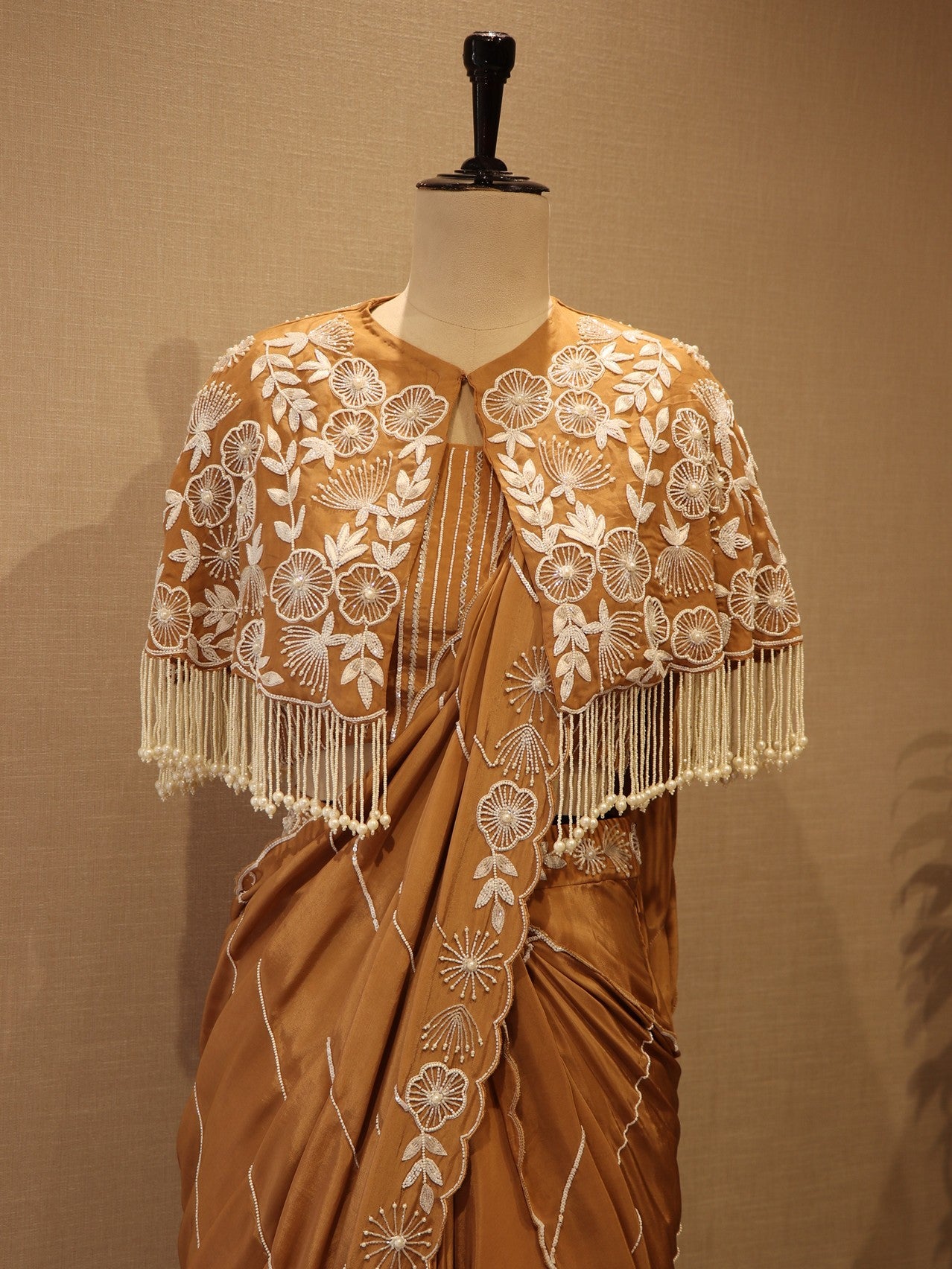 beige drape saree with cape