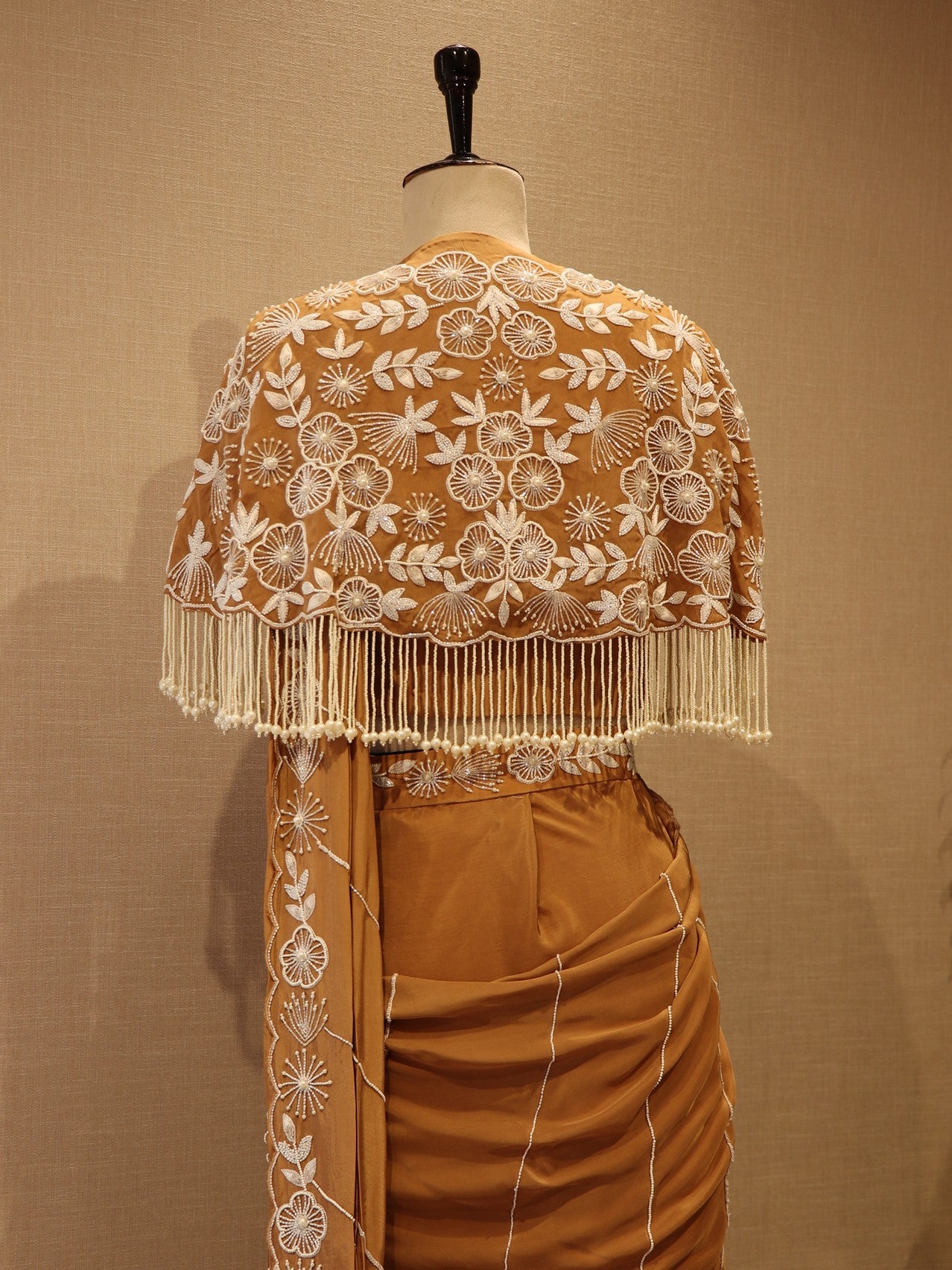 beige drape saree with cape