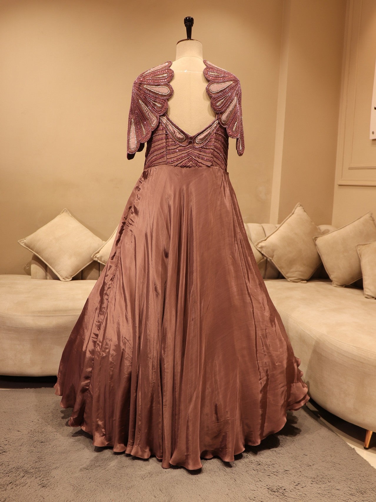 Mauve embroidered cape sleevs gown