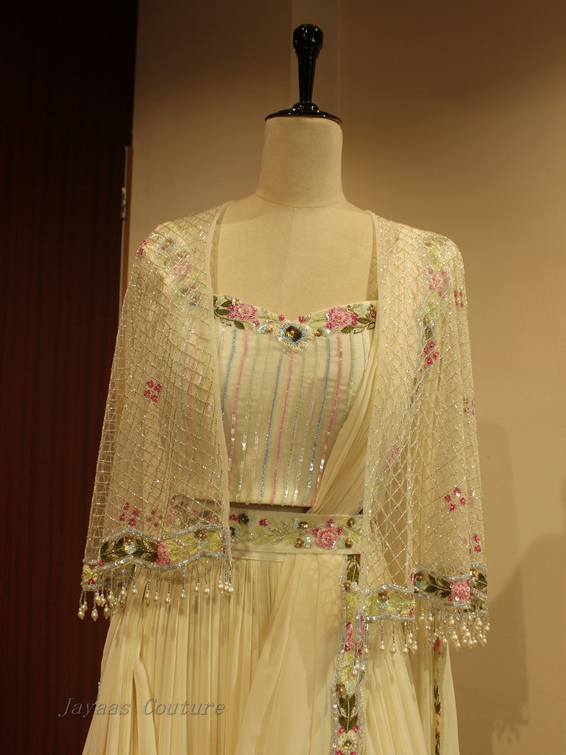 Off white lehenga with cape