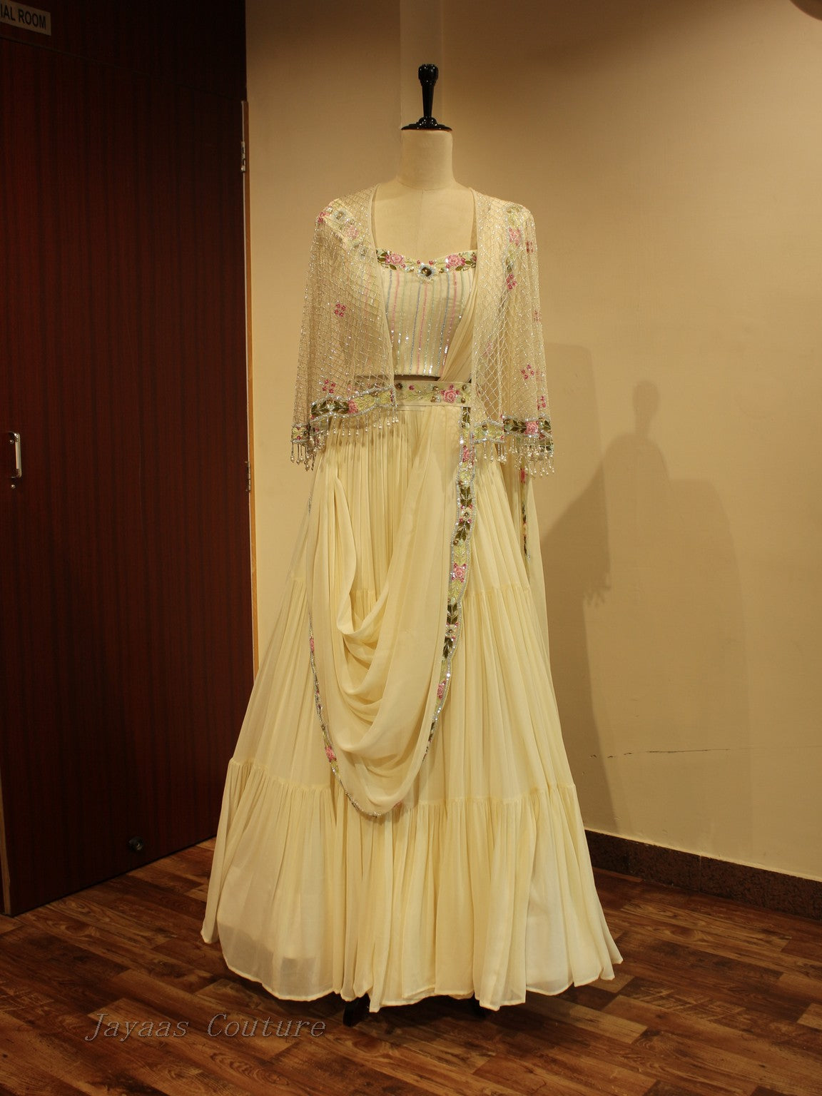 Off white lehenga with cape