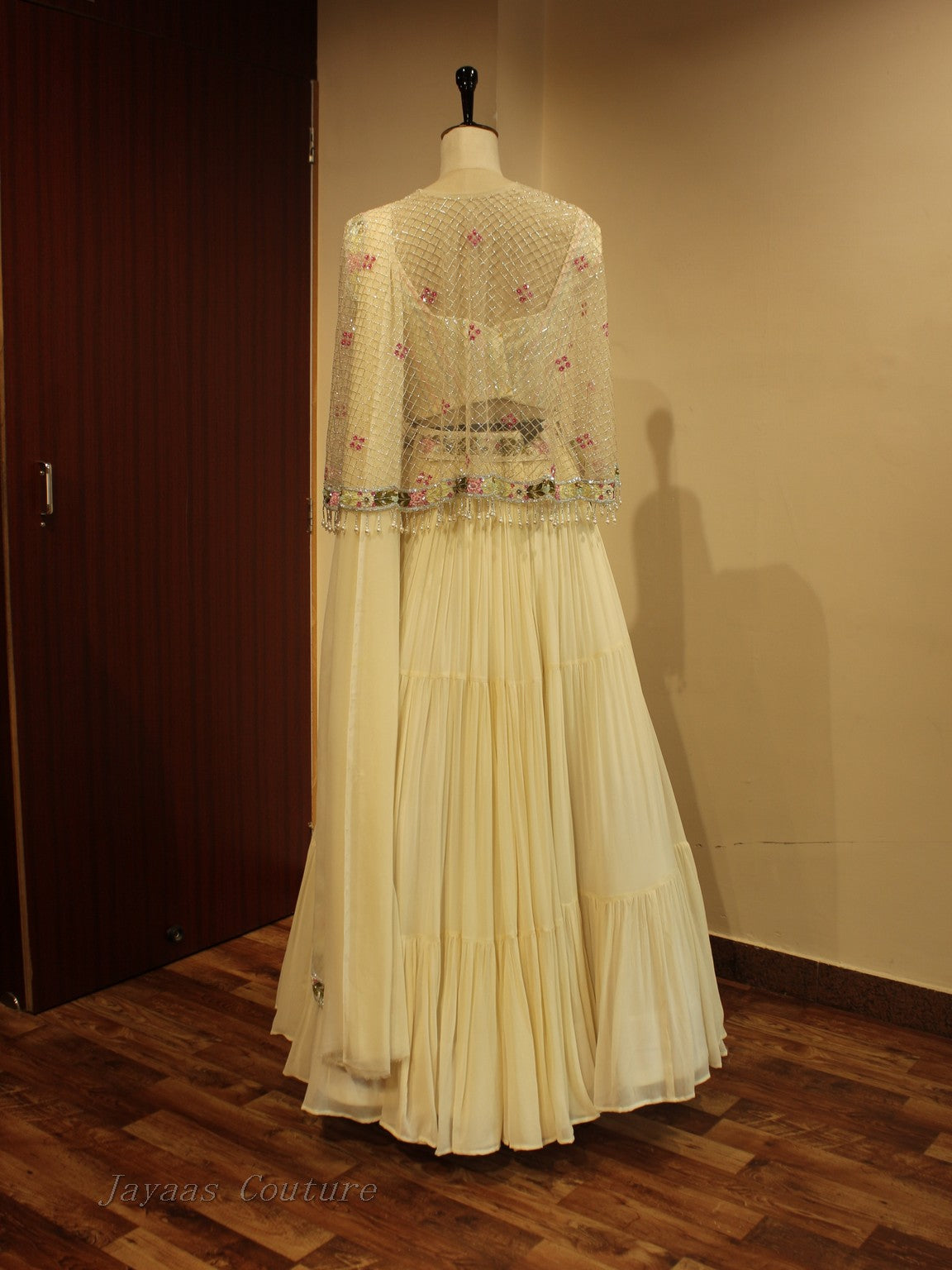 Off white lehenga with cape