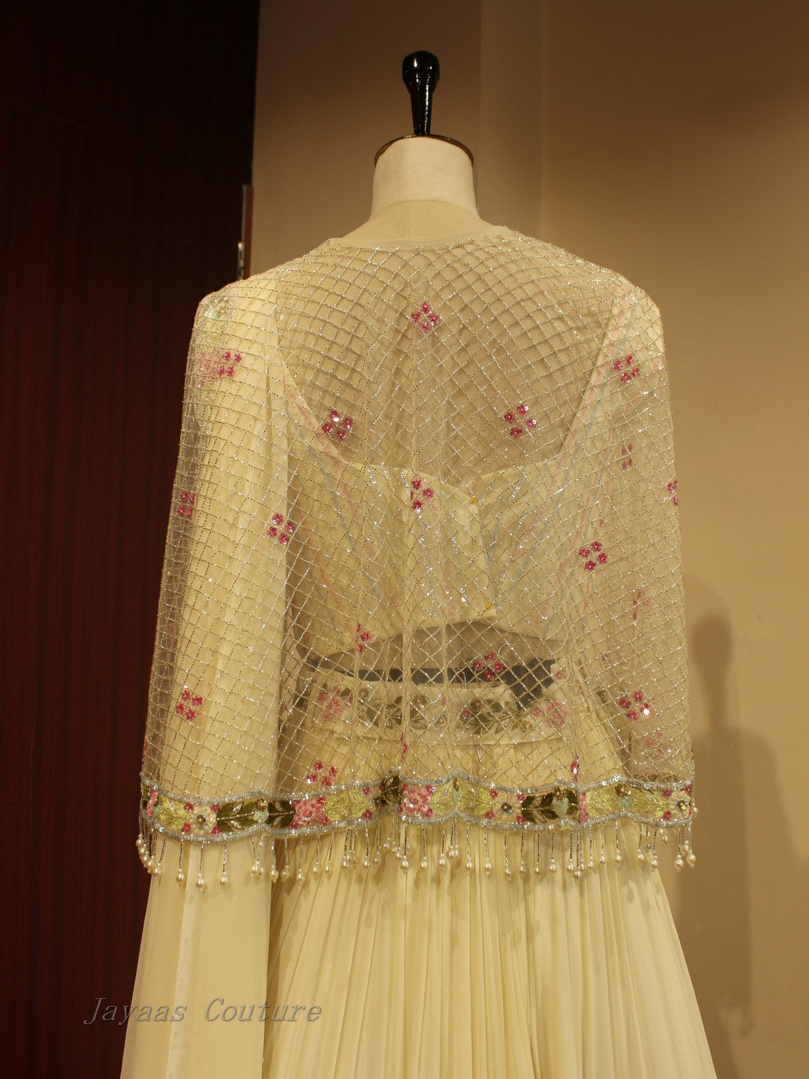 Off white lehenga with cape