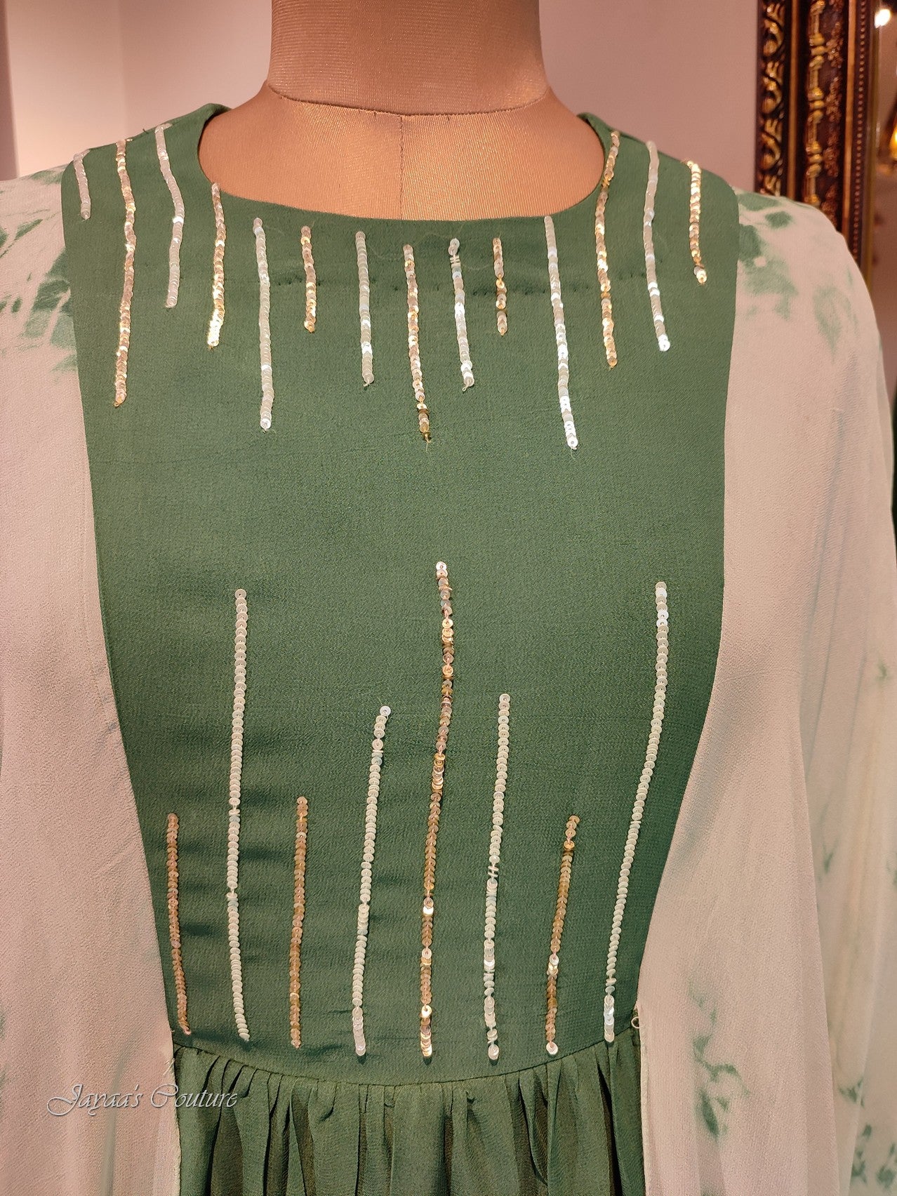 Green gown with toe and dye drape sleeves