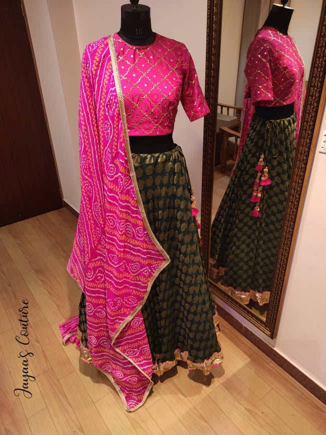 Bottle green lehenga with hot pink blouse and bandhani dupatta