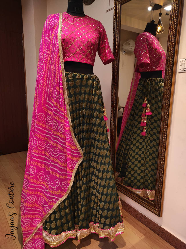 Bottle green lehenga with hot pink blouse and bandhani dupatta