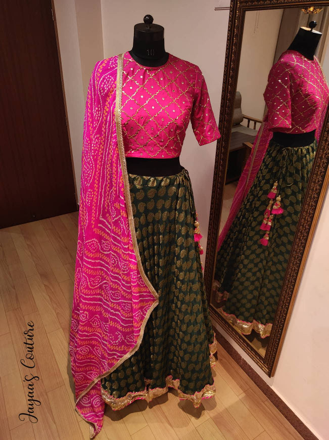 Bottle green lehenga with hot pink blouse and bandhani dupatta