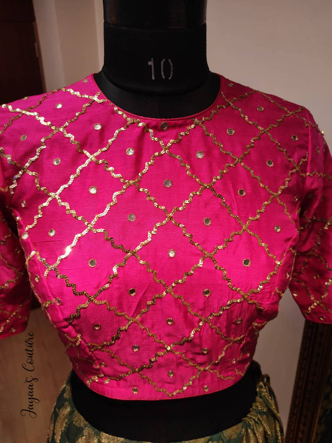 Bottle green lehenga with hot pink blouse and bandhani dupatta