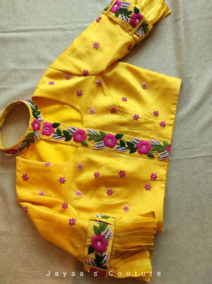 Yellow lehenga blouse and dark pink dupatta