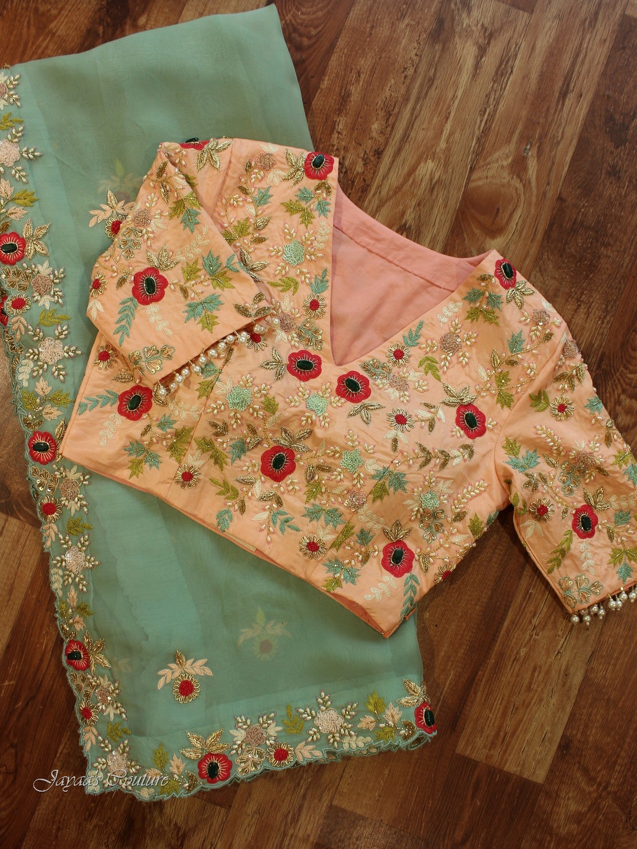 Sea green saree with heavy peach blouse