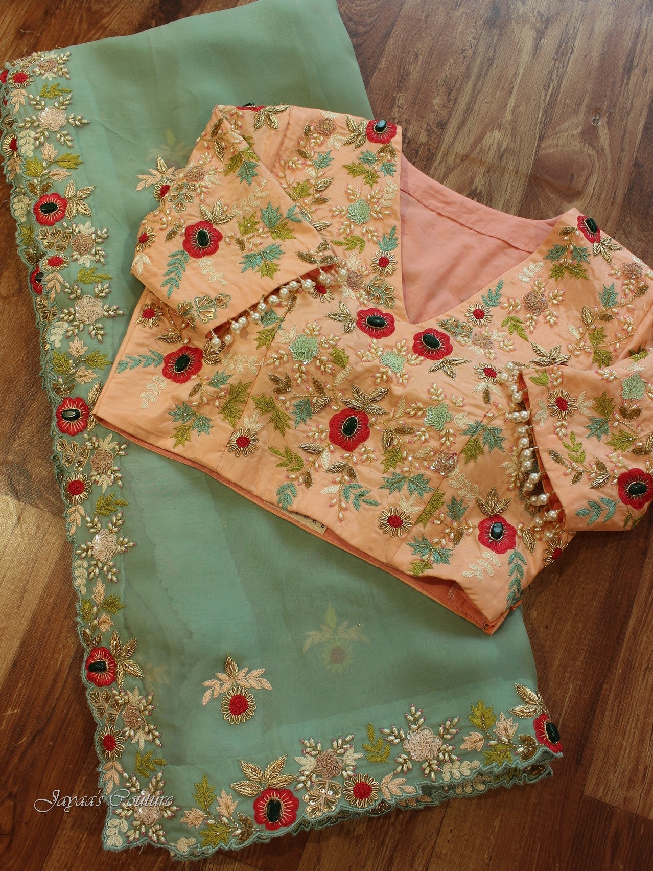 Sea green saree with heavy peach blouse