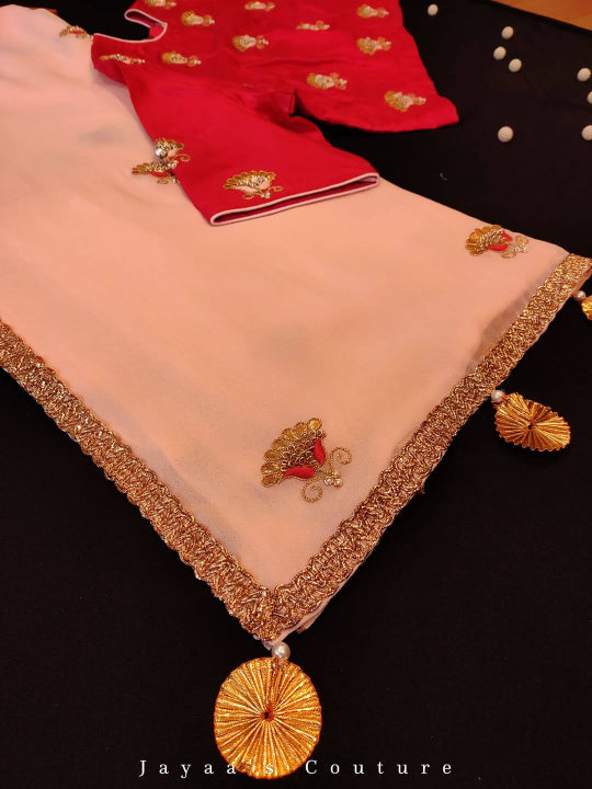 Peach gota work saree with tomato red blouse