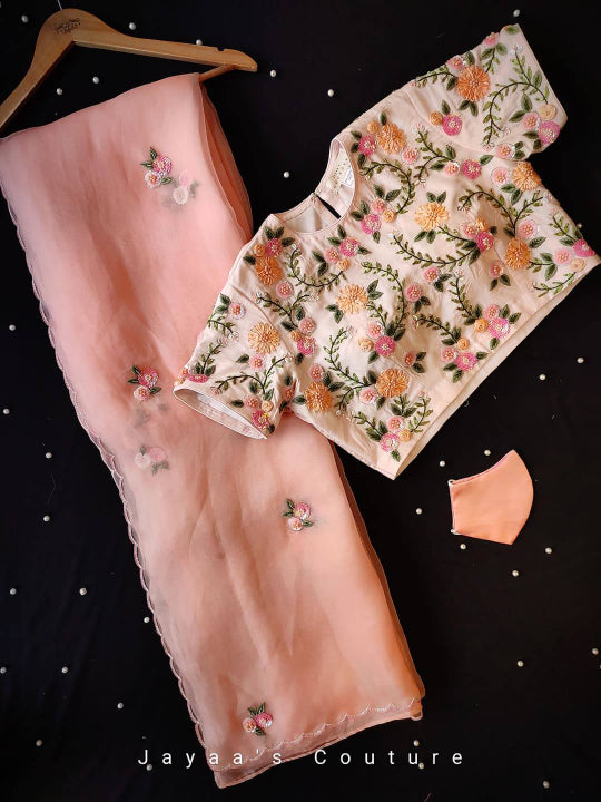 PEACH ORGANZA SAREE & CREPE BLOUSE ADORNED WITH HAND WORK