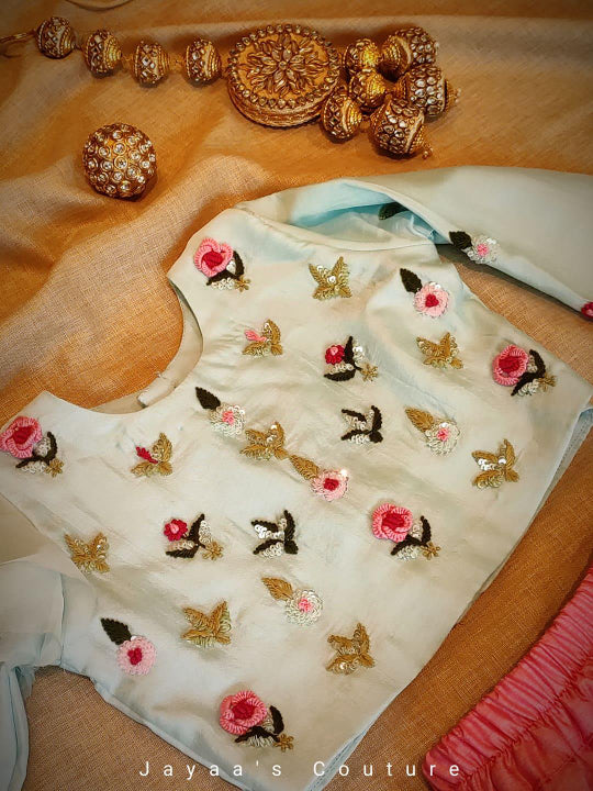 Pastel blueish green top with pink skirt