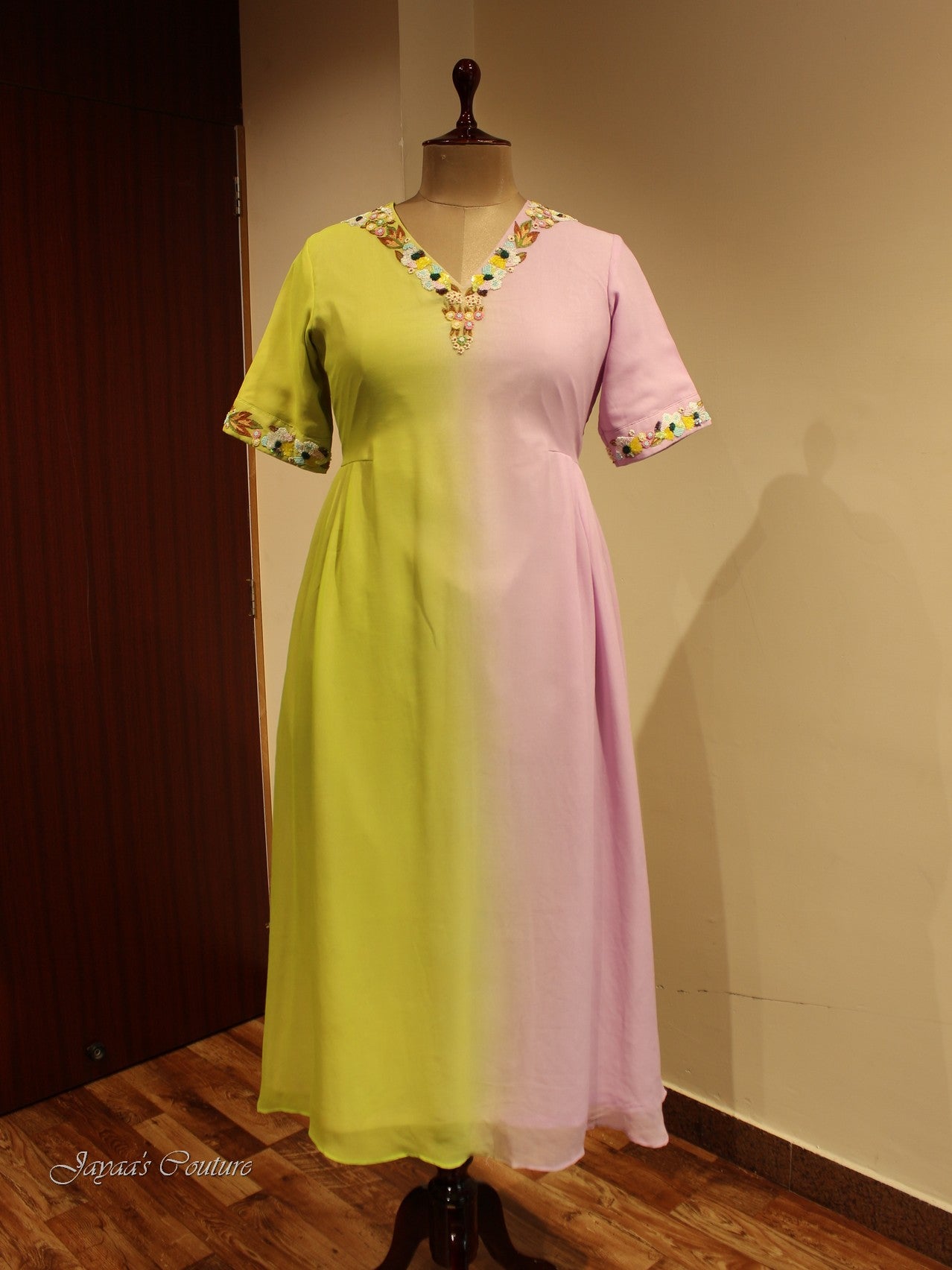 Pink dhoti draped dress with bandhani peplum style jacket.