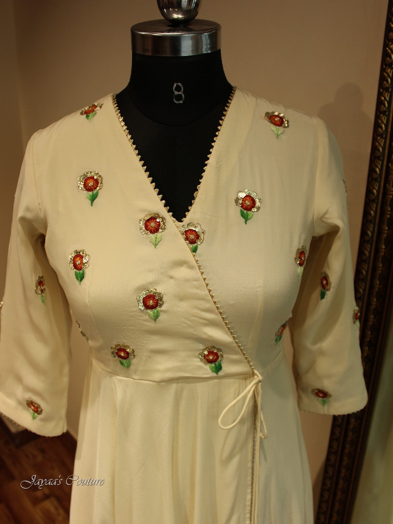 Off white gown with red orange shaded dupatta