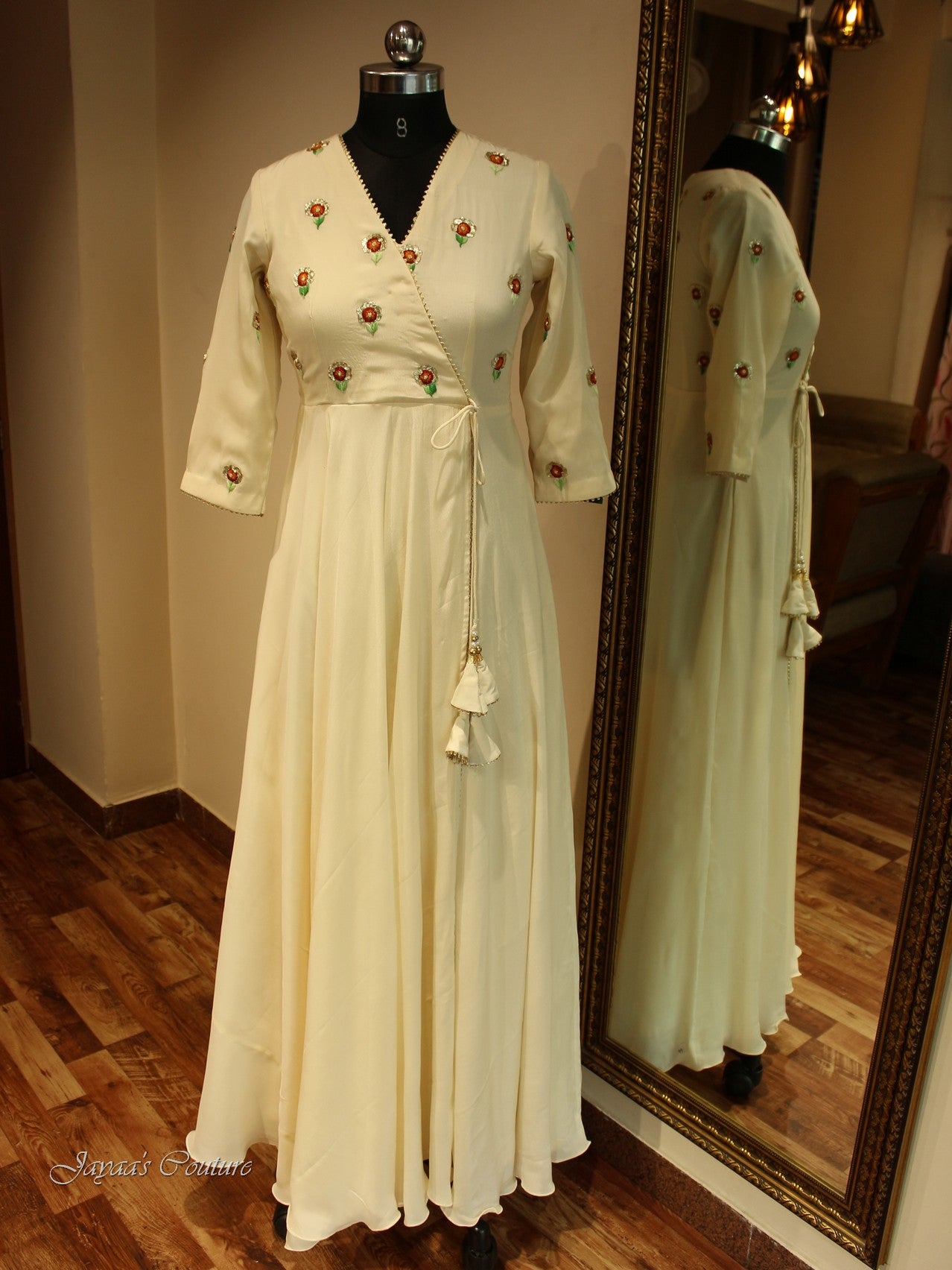 Off white gown with red orange shaded dupatta