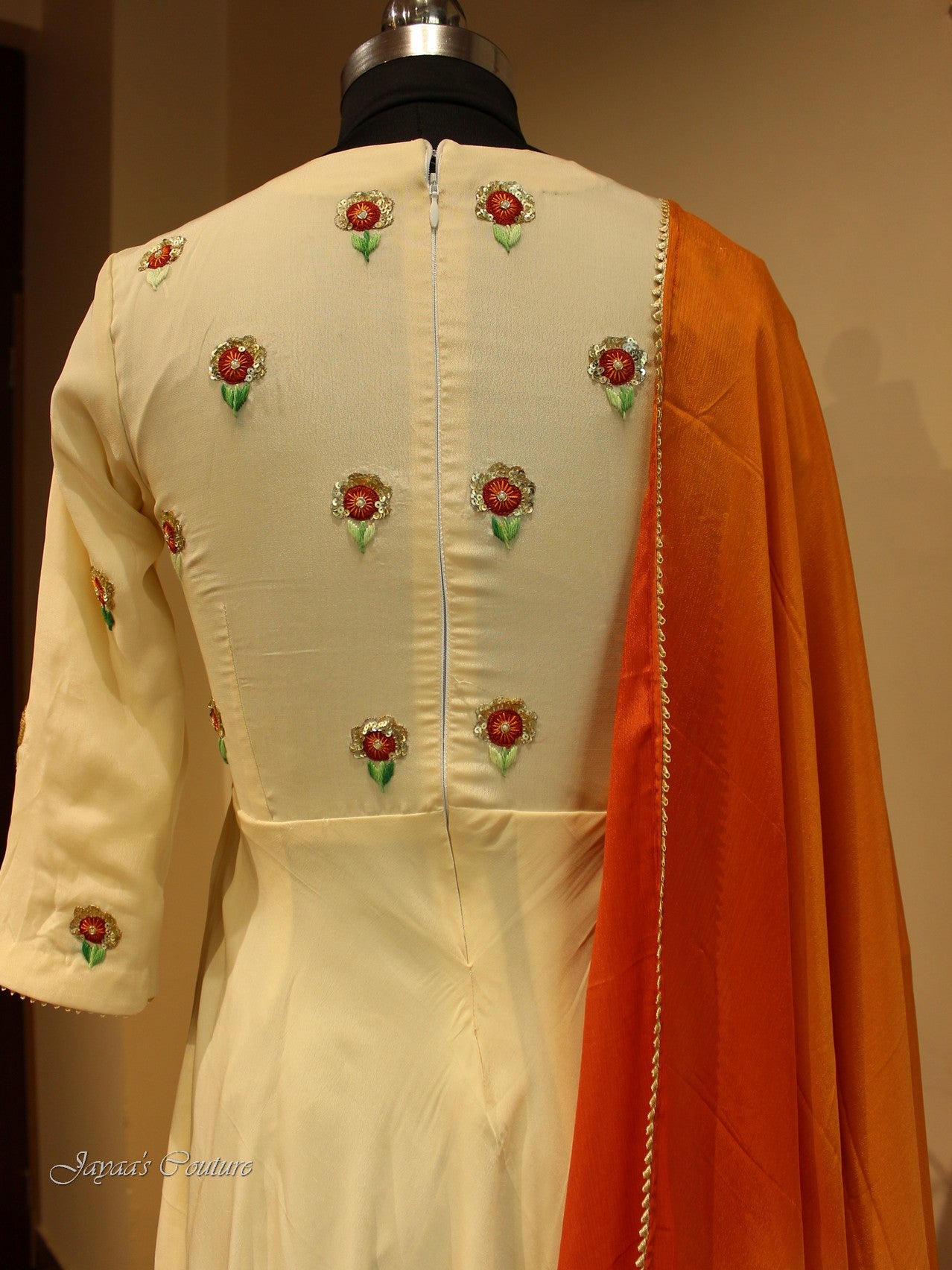 Off white gown with red orange shaded dupatta