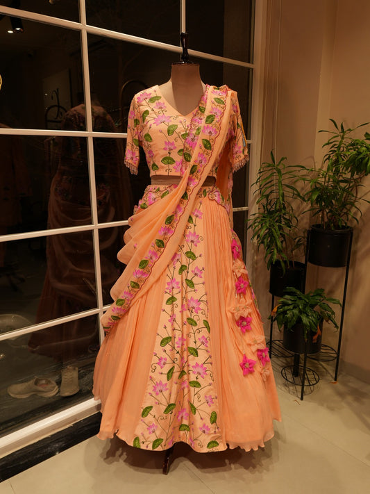 Pastel rust orange hand painted radha krishna ji pichwai lehenga set