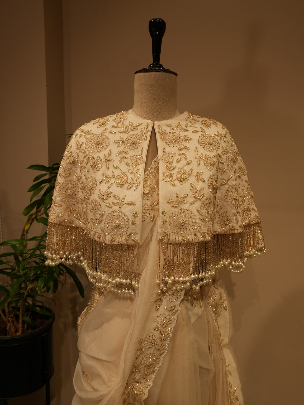 Off white  embroidered saree with cape
