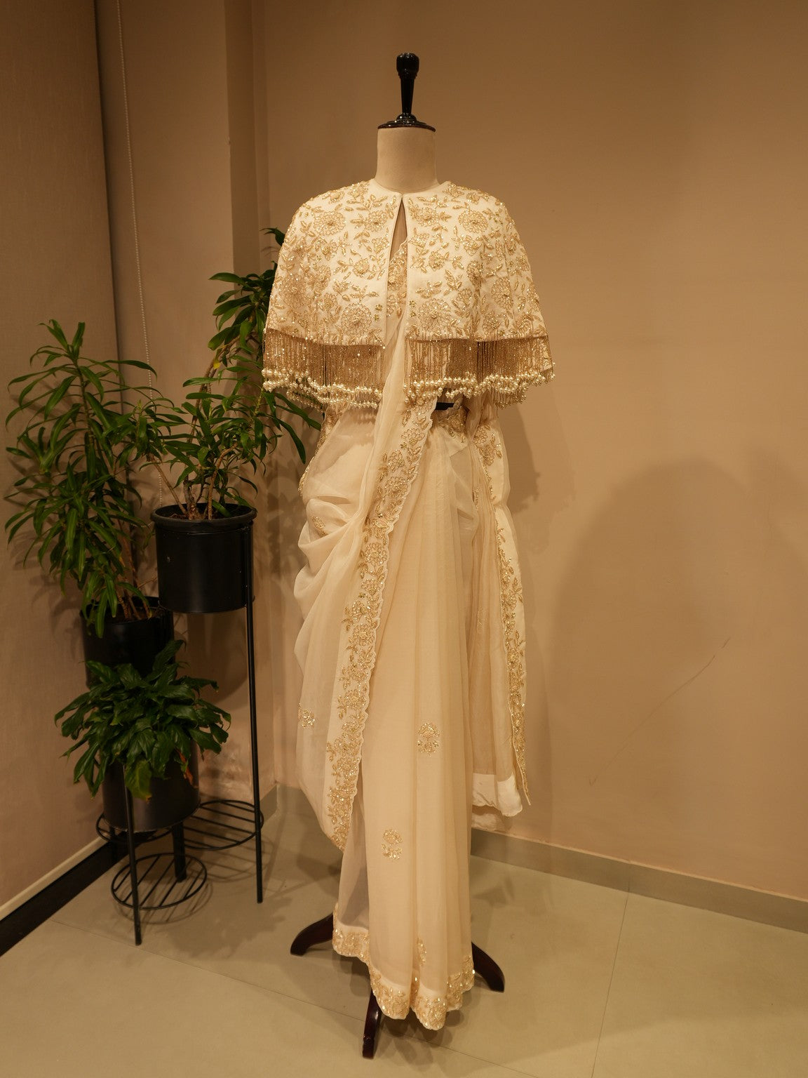 Off white  embroidered saree with cape