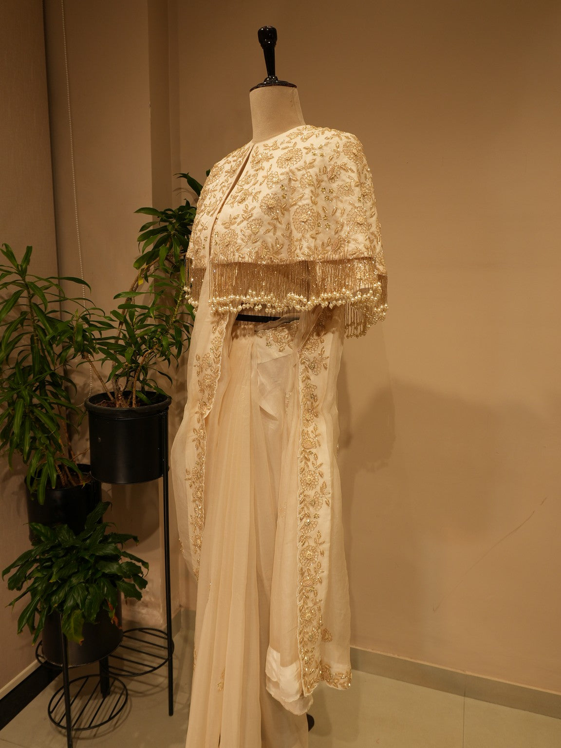 Off white  embroidered saree with cape