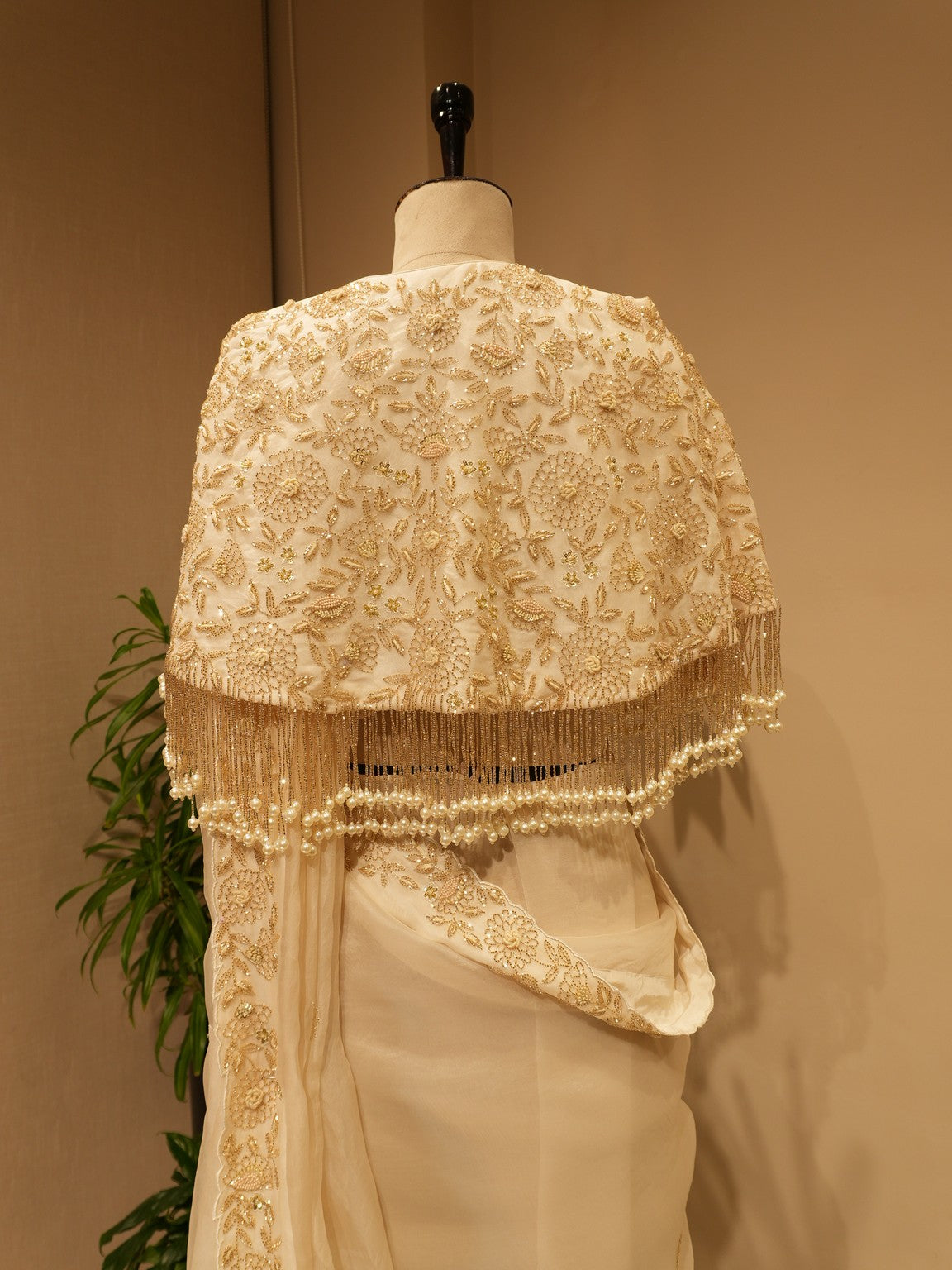 Off white  embroidered saree with cape