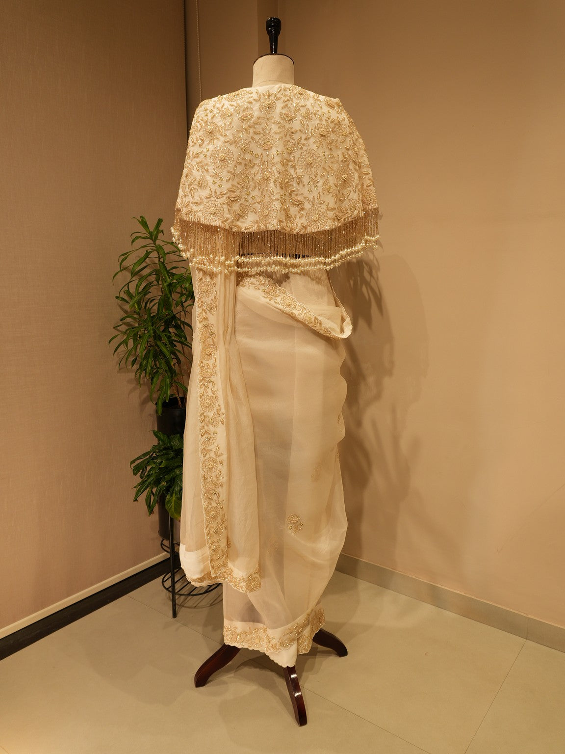 Off white  embroidered saree with cape