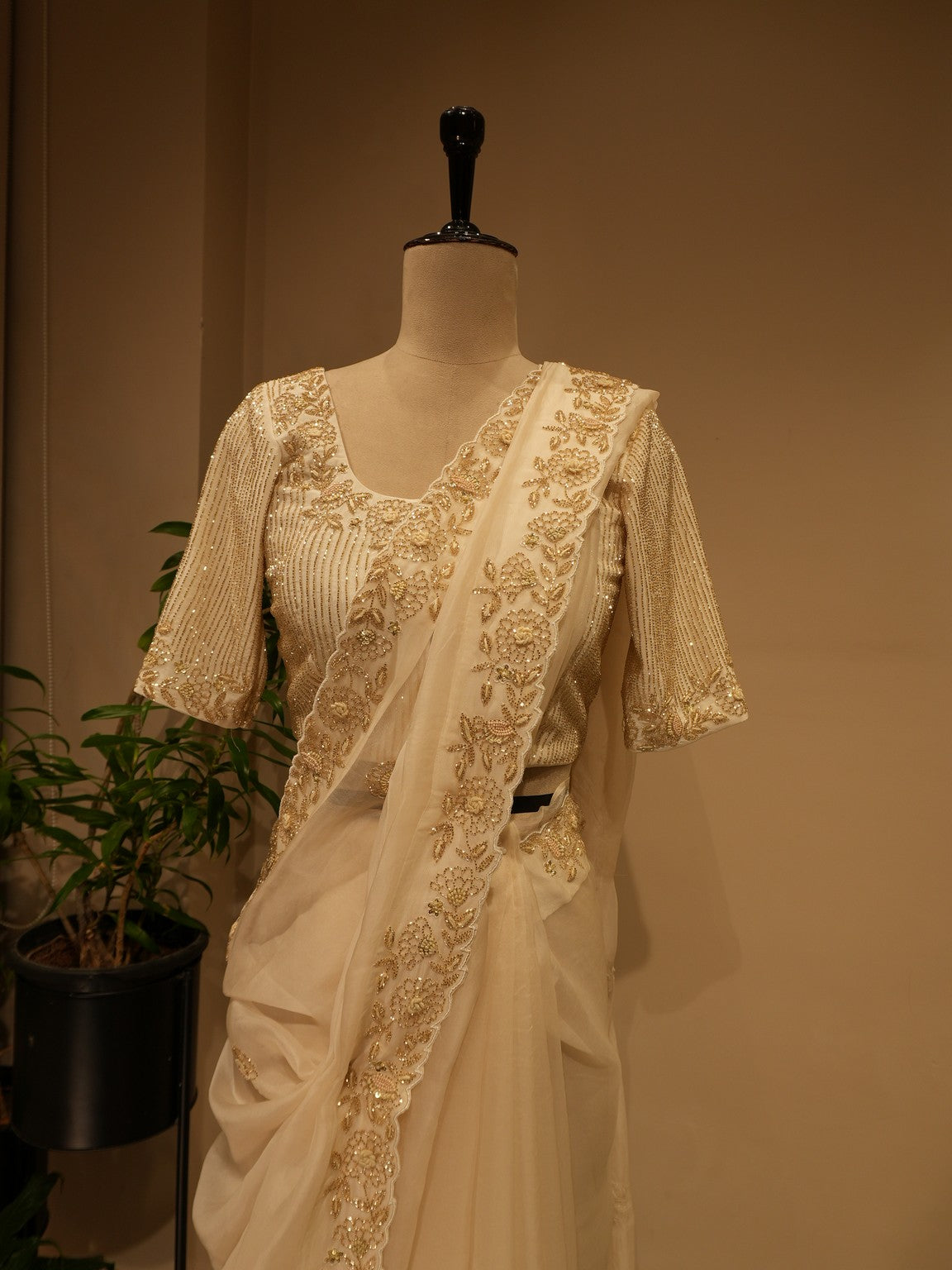Off white  embroidered saree with cape