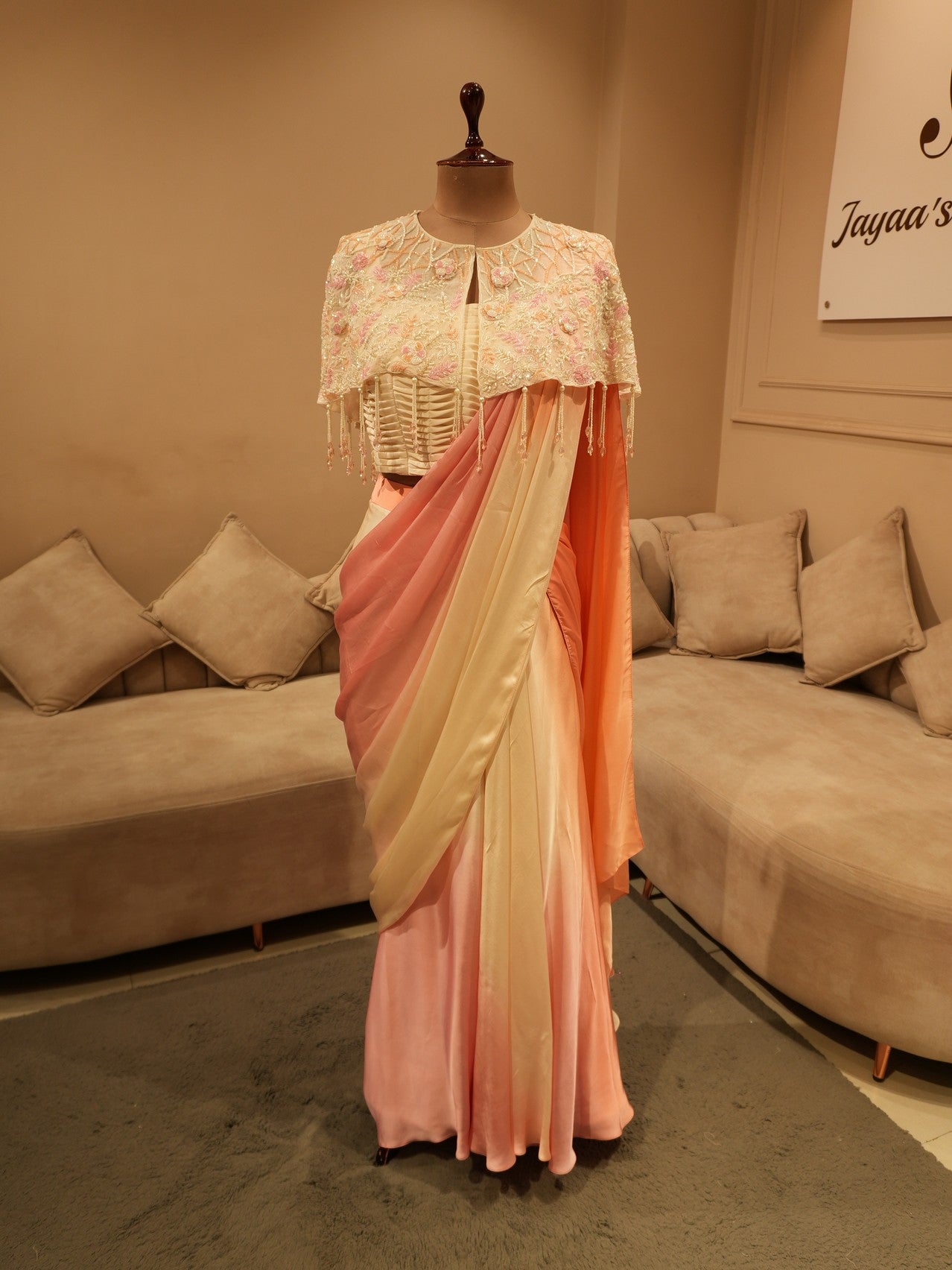 Peach pink shaded drape saree with cape