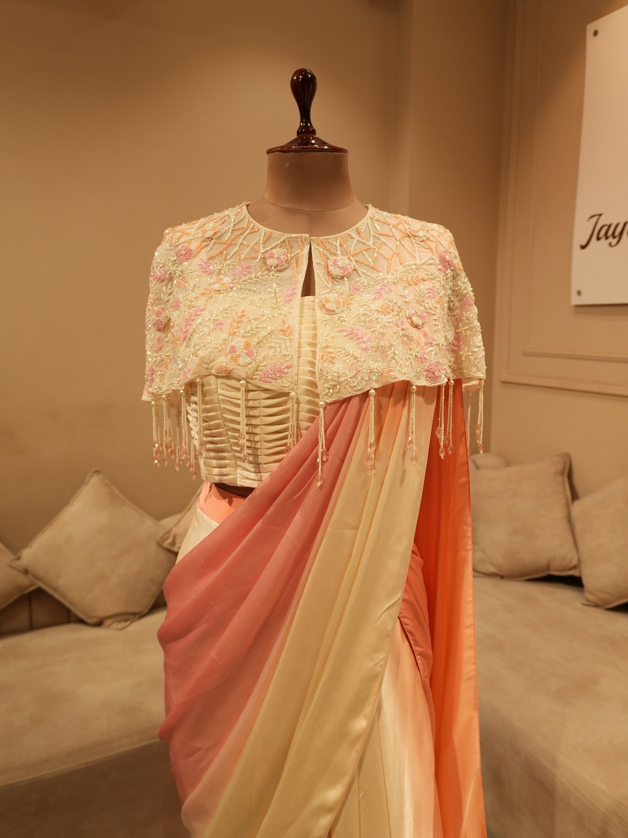 Peach pink shaded drape saree with cape