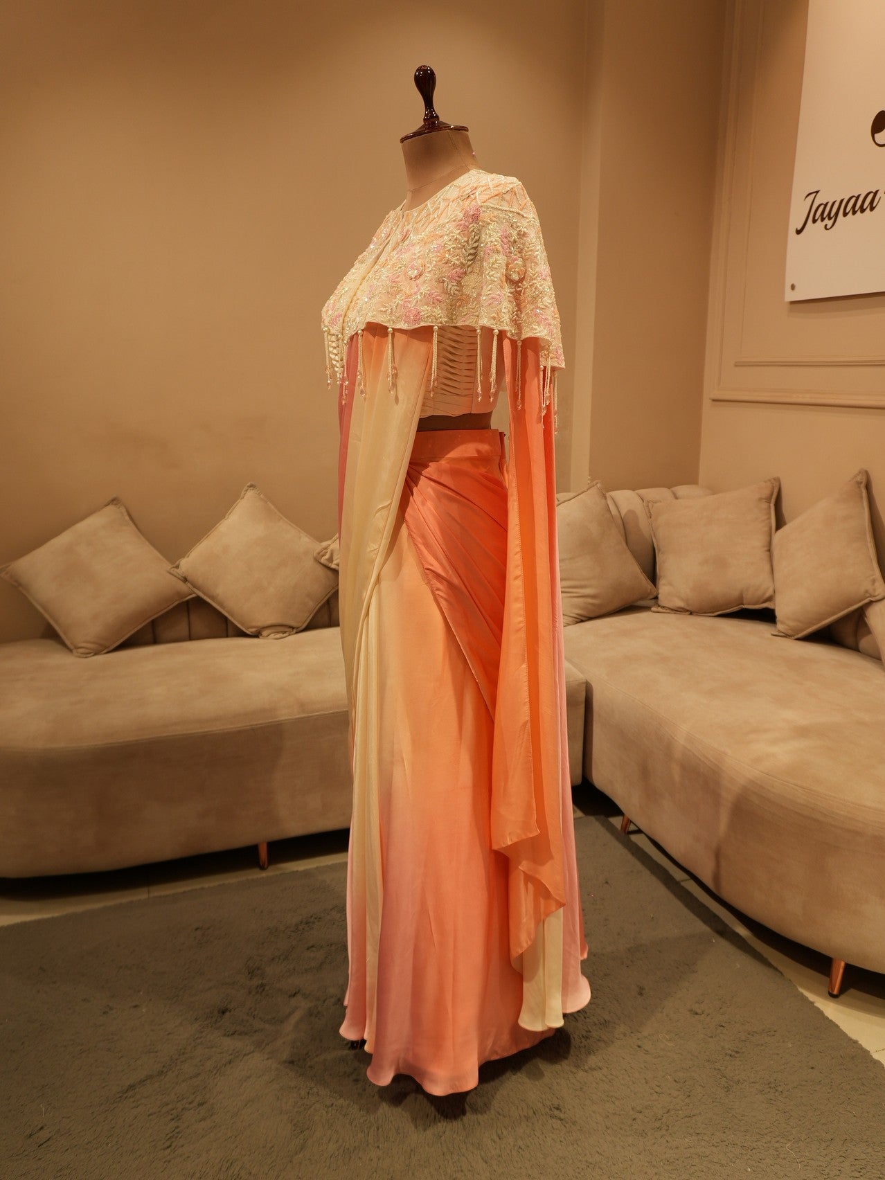 Peach pink shaded drape saree with cape