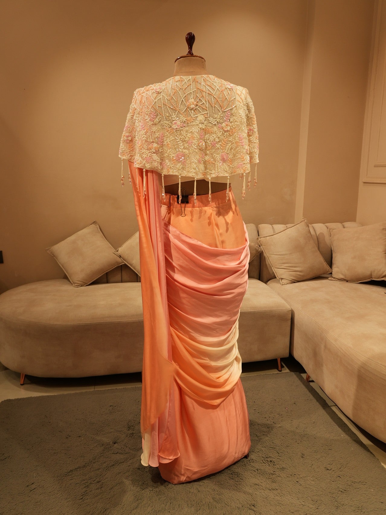 Peach pink shaded drape saree with cape