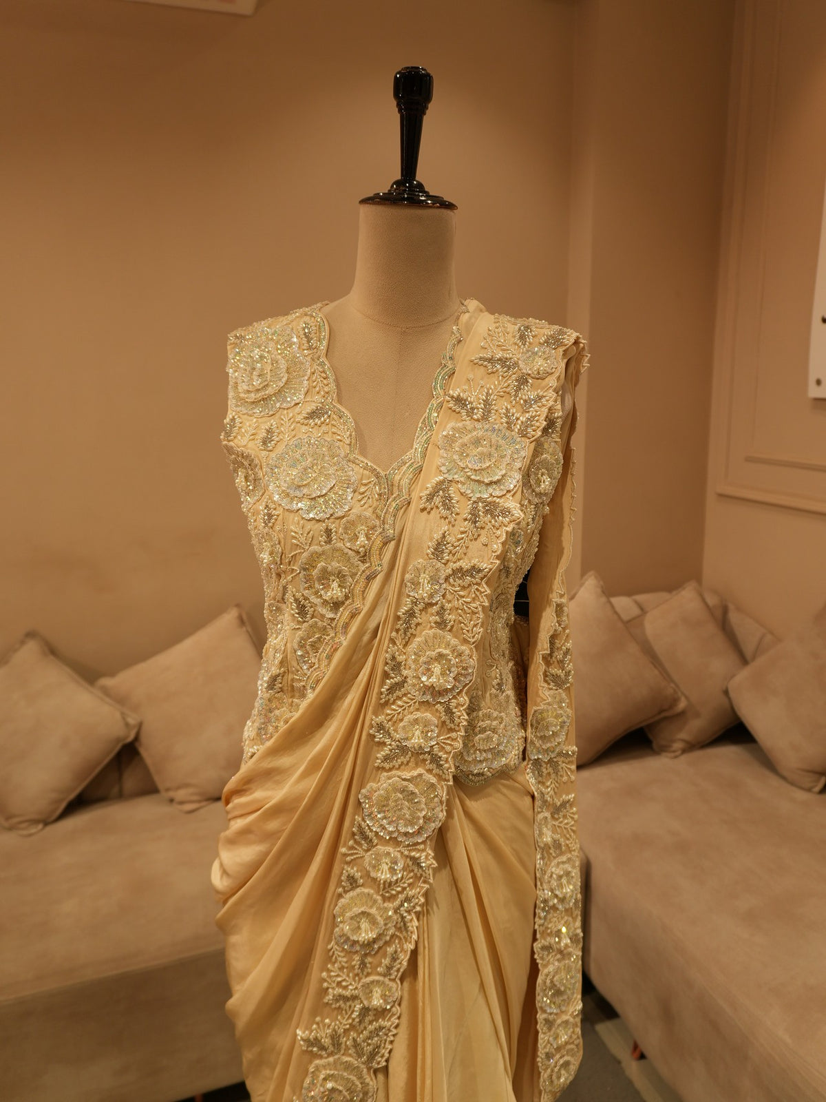 Beige embroidered drape saree