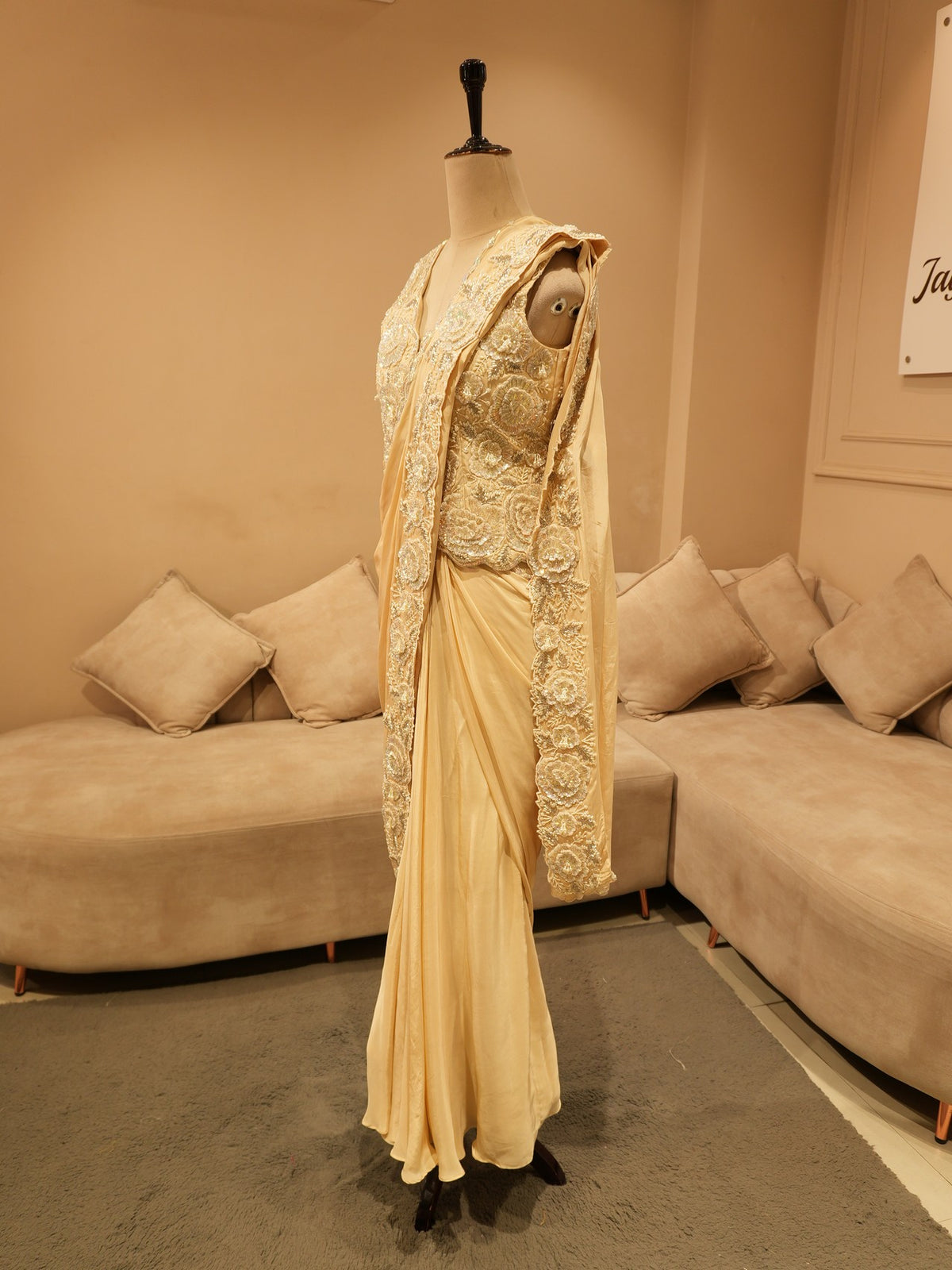 Beige embroidered drape saree