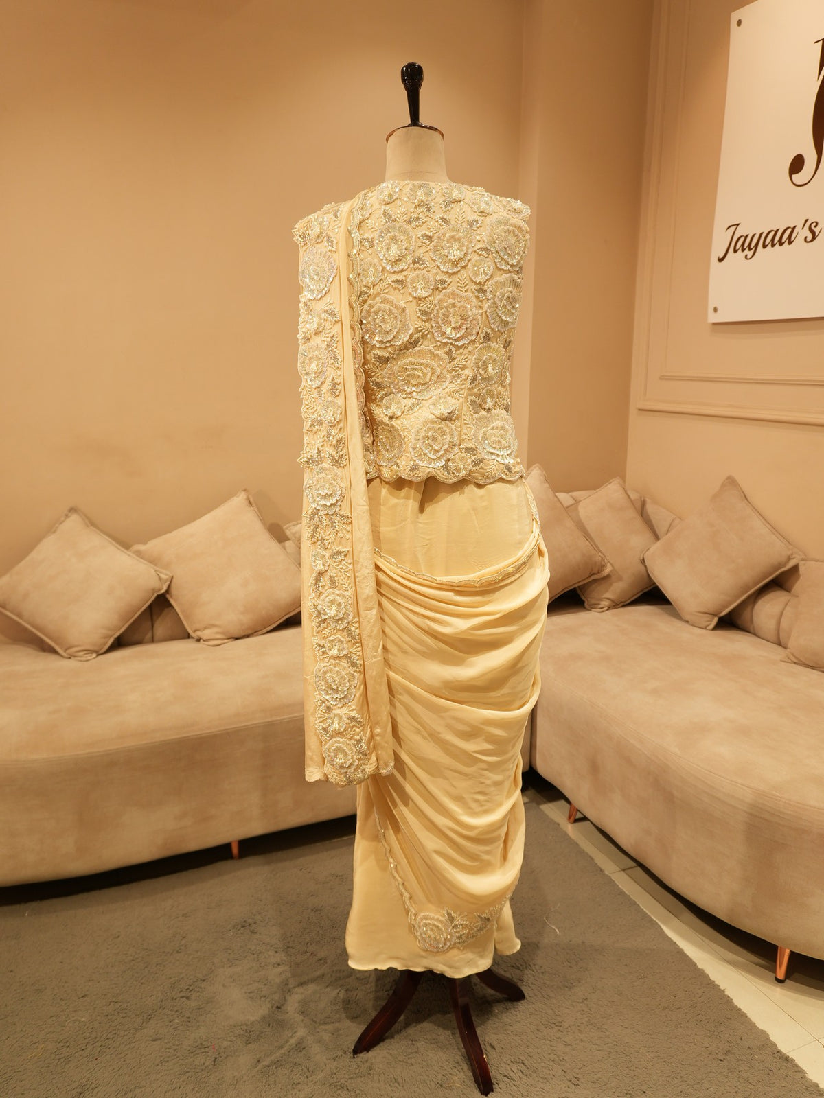 Beige embroidered drape saree