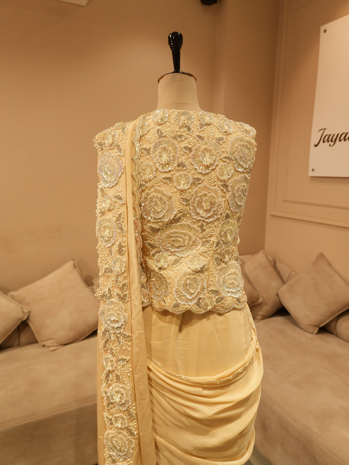 Beige embroidered drape saree