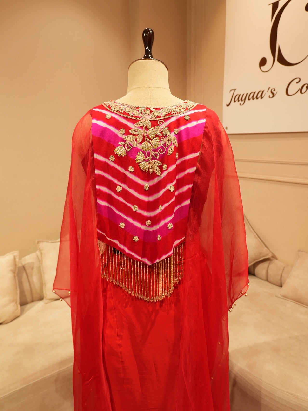 Red zardosi cape top with drape skirt