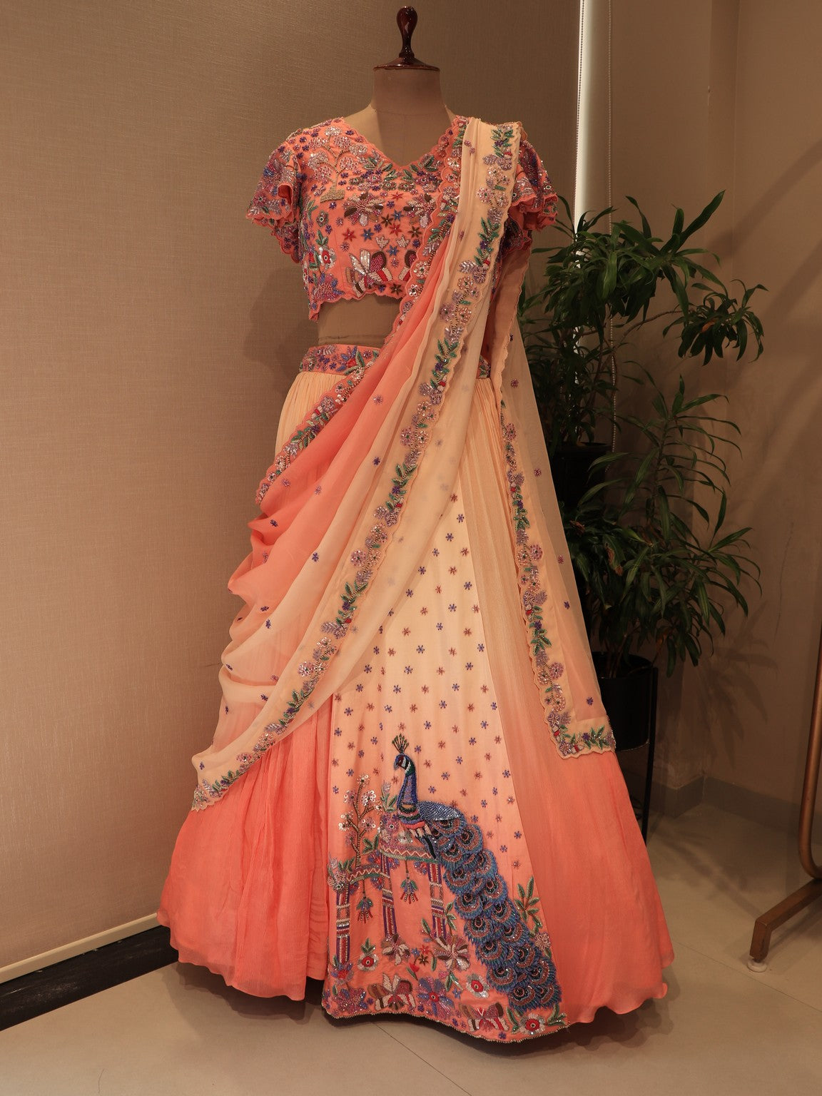 Peach shaded shrinathji peacock embroidered lehenga set