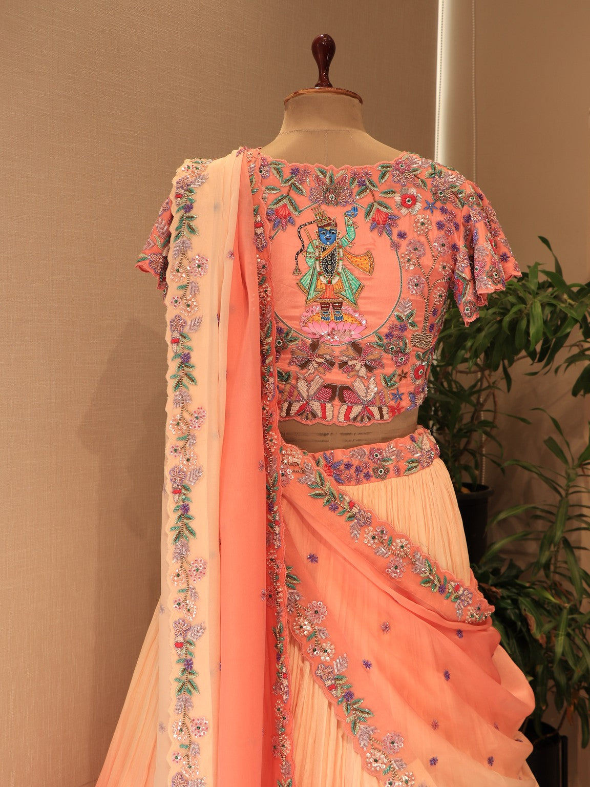 Peach shaded shrinathji peacock embroidered lehenga set
