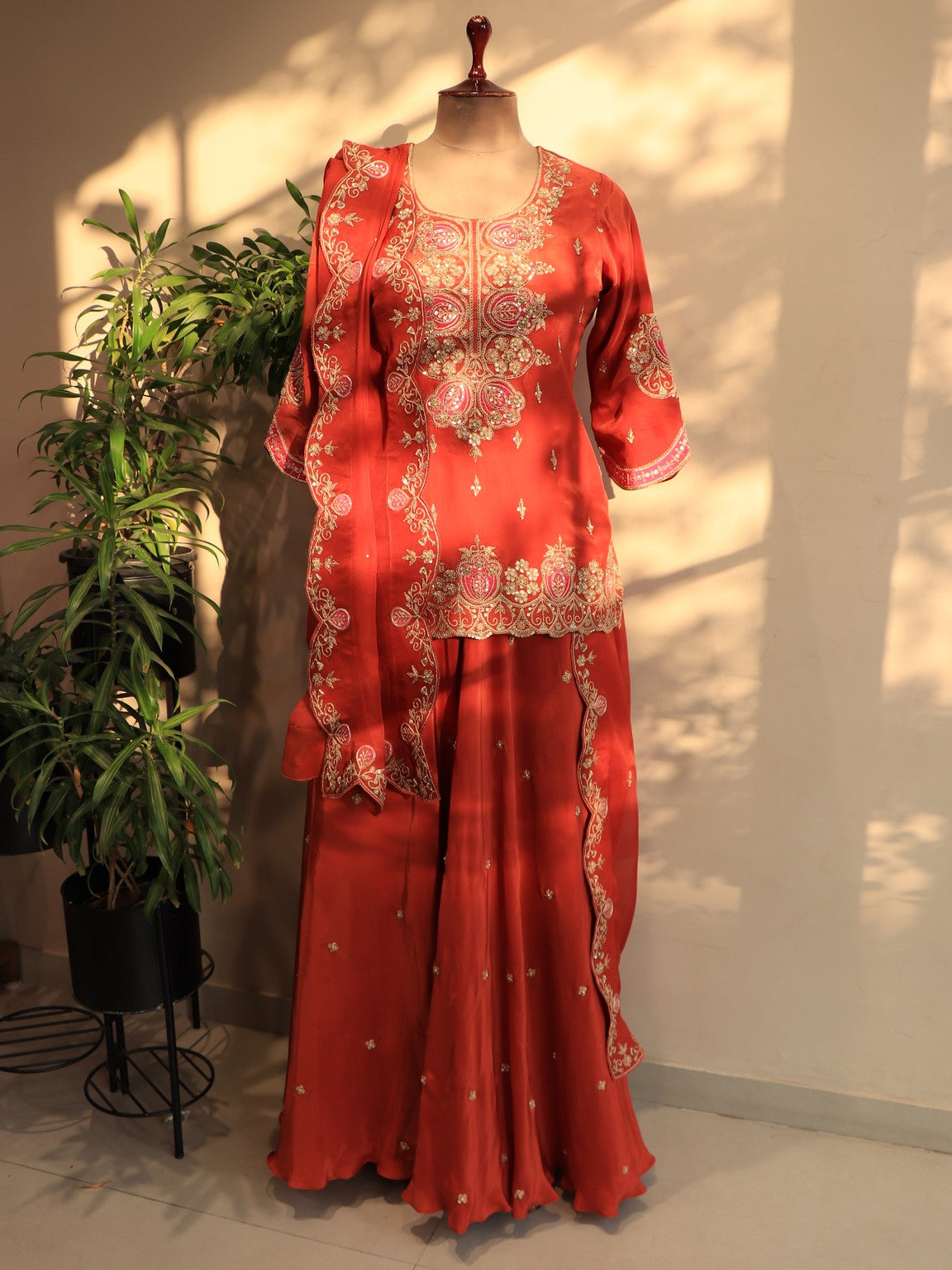 Rust orange kurta with skirt and dupatta