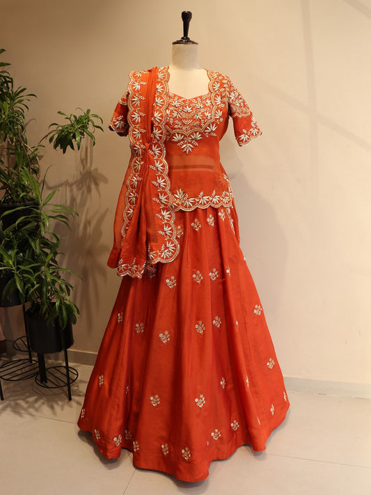 Rust orange zardosi peplum top with skirt dupatta