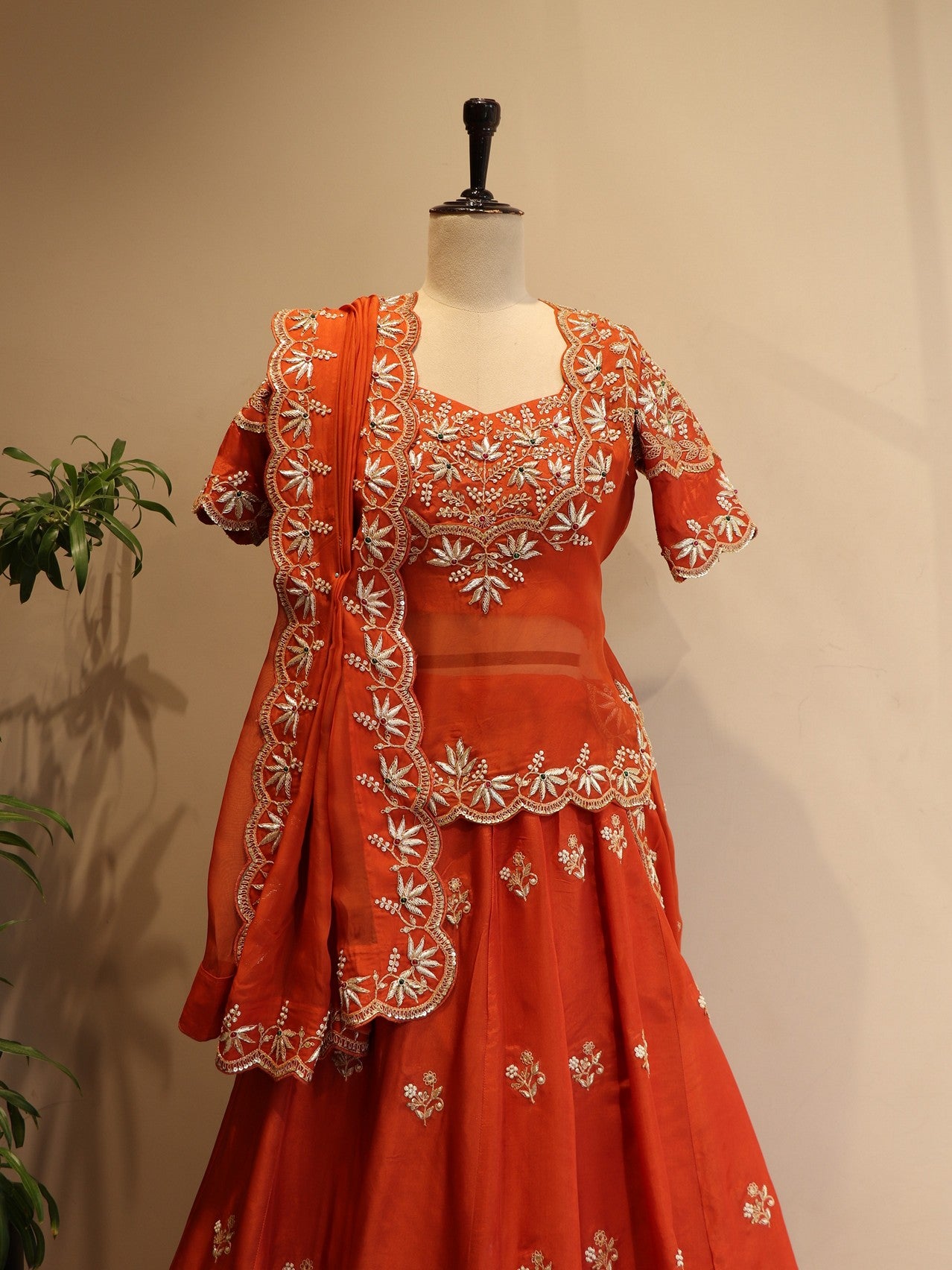 Rust orange zardosi peplum top with skirt dupatta