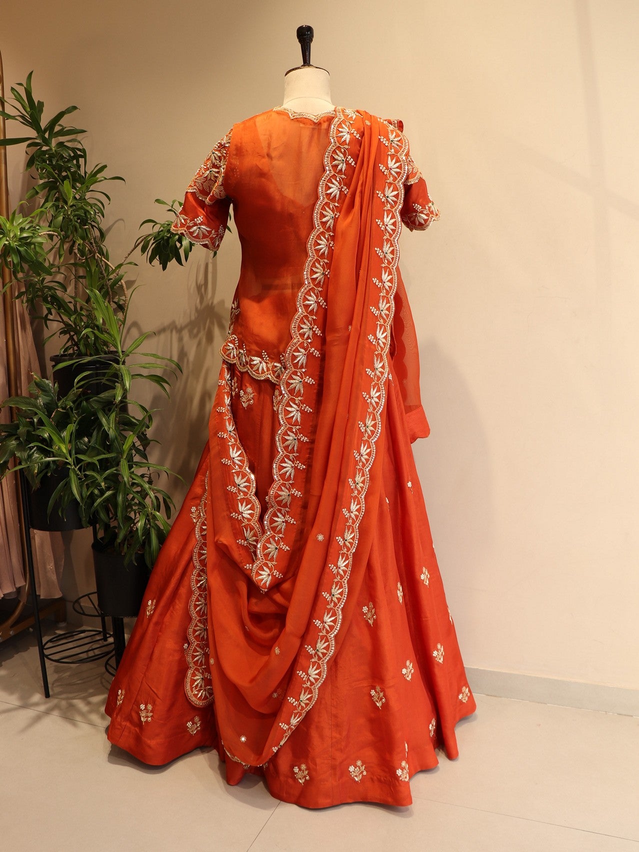 Rust orange zardosi peplum top with skirt dupatta