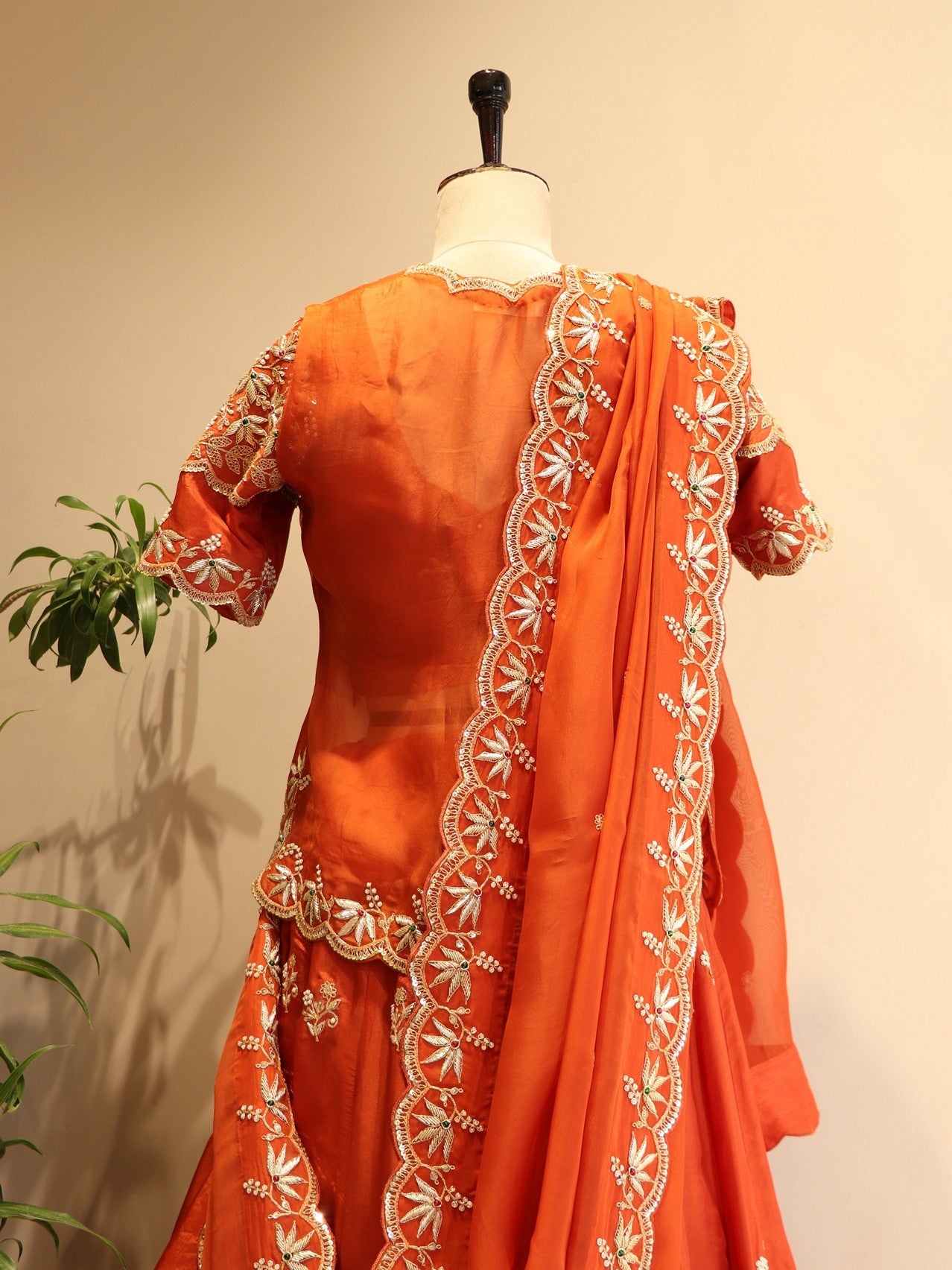 Rust orange zardosi peplum top with skirt dupatta
