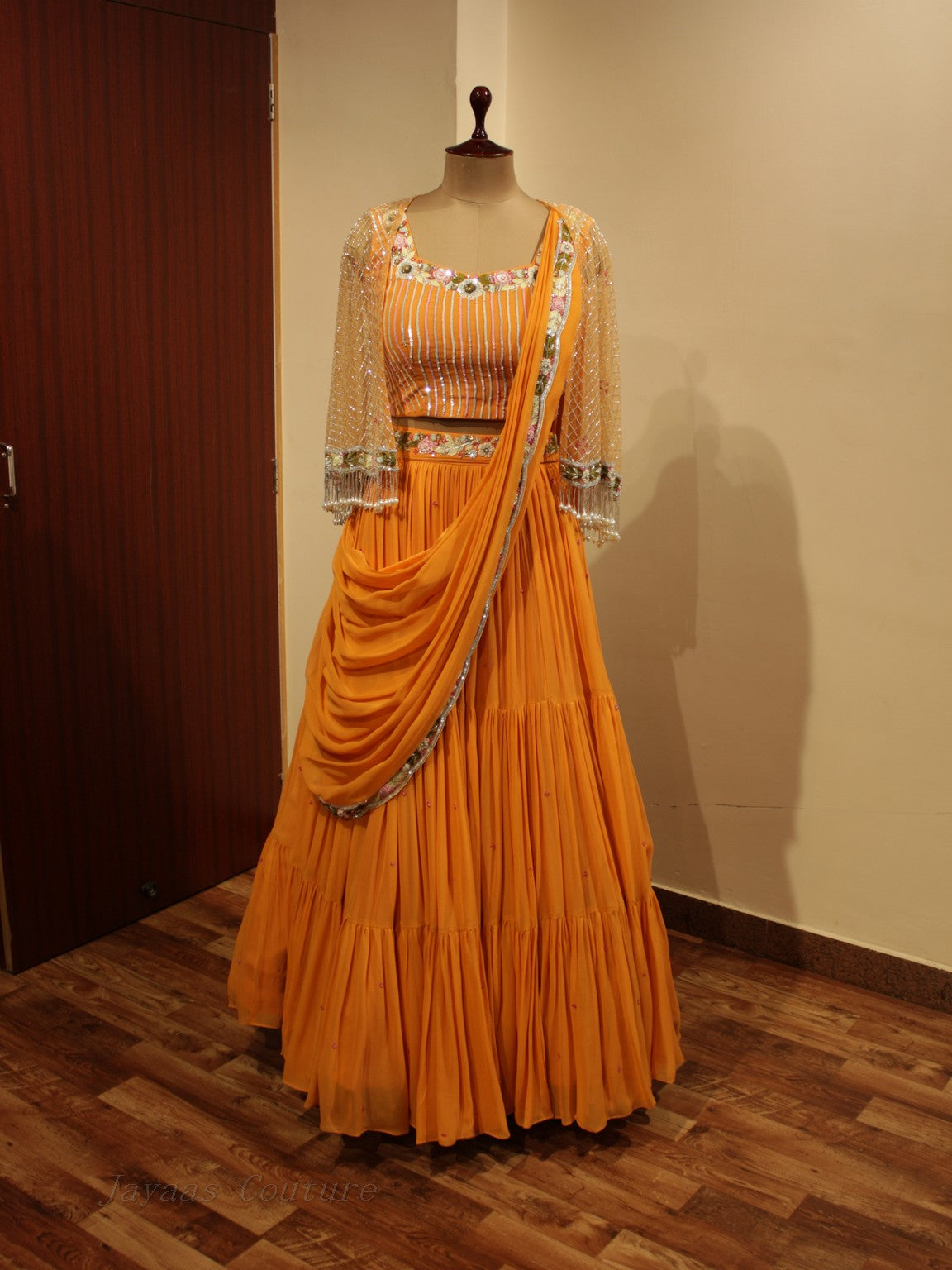 Orange lehenga set with cape