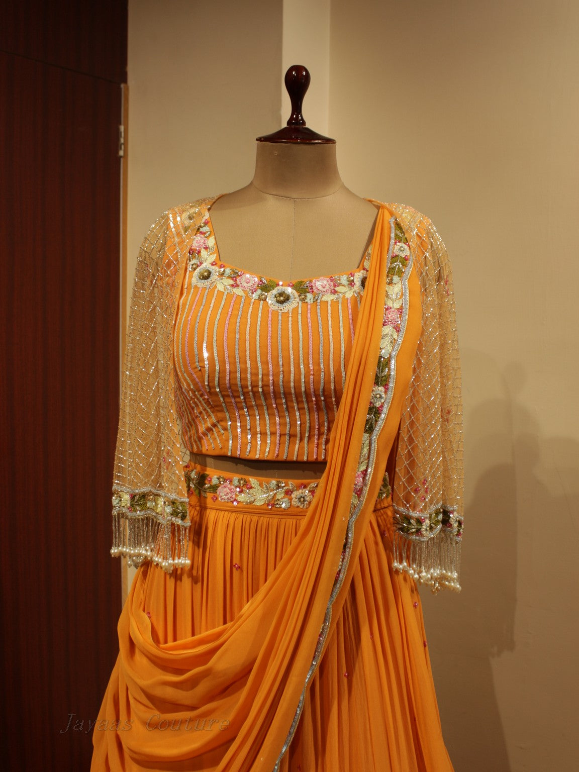 Orange lehenga set with cape