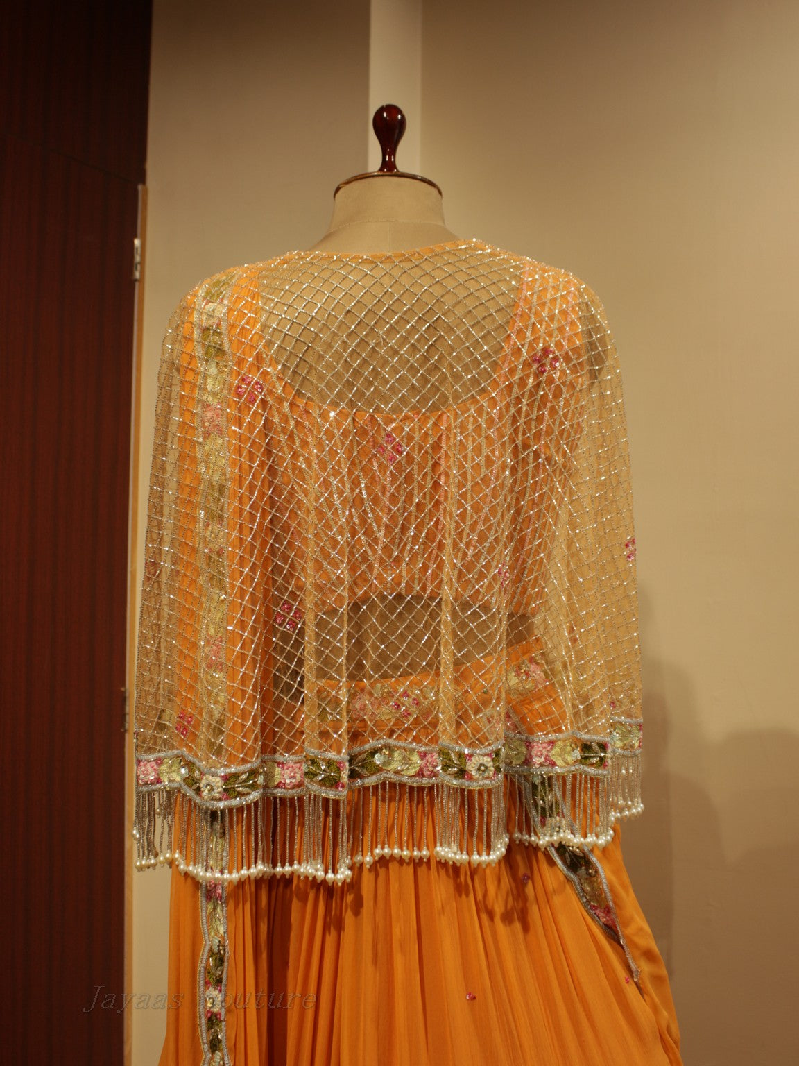 Orange lehenga set with cape